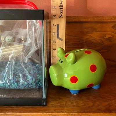 Fish aquarium and ceramic piggy bank
