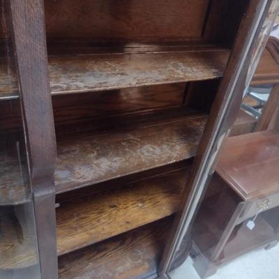 Sale Photo Thumbnail #1761: Antique Curved Glass Tiger Oak China Cabinet- Approx 37 3/4" x 14" x 57" Tall.  Item has some wear to finish- please see all pictures.  Shelves have plate grooves.