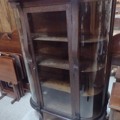 Sale Photo Thumbnail #1759: Antique Curved Glass Tiger Oak China Cabinet- Approx 37 3/4" x 14" x 57" Tall.  Item has some wear to finish- please see all pictures.  Shelves have plate grooves.