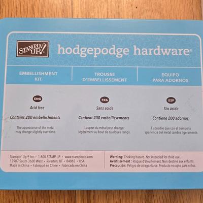 Hodgepodge Hardware and Crafting Paper in a Storage Container