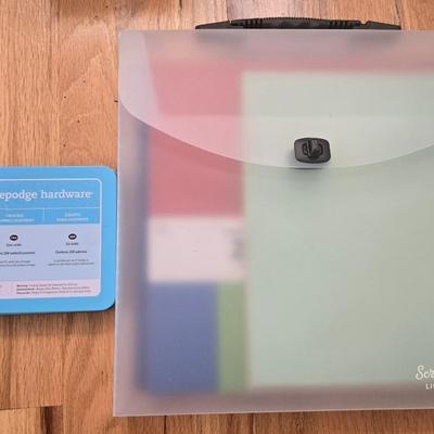 Hodgepodge Hardware and Crafting Paper in a Storage Container