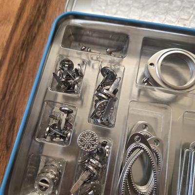 Hodgepodge Hardware and Crafting Paper in a Storage Container