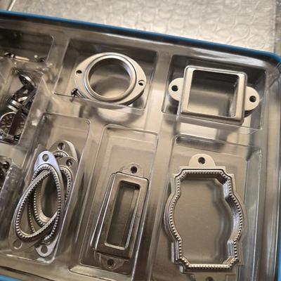 Hodgepodge Hardware and Crafting Paper in a Storage Container