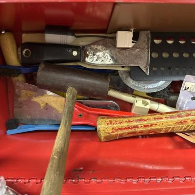 Red metal toolbox with tools
