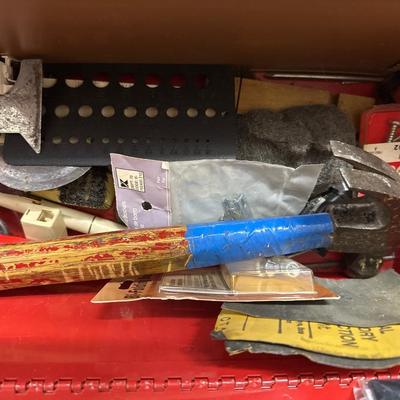 Red metal toolbox with tools