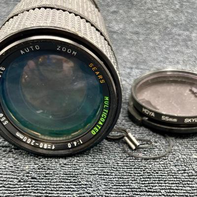 Sale Photo Thumbnail #375: Sears 35mm Camera Auto Zoom 80-200MM 1:4.0 Lens with HOYA 55MM Skylight Filter, Lens Cap and User's Guide.  Good condition.