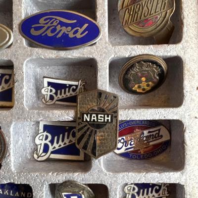 Vintage radiator vehicle emblems with case