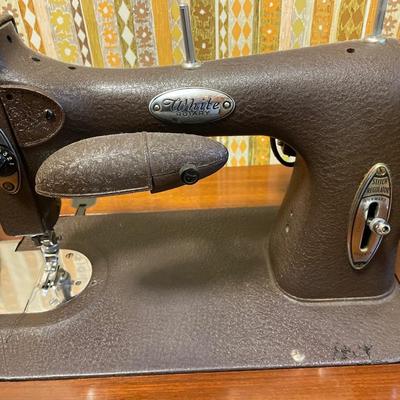 White Rotary Sewing machine in table