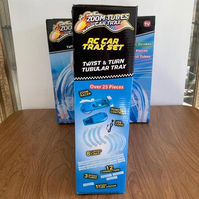 LOT 28 B: 3 NIP Zoom Tubes Car Trax RC Car Trax Set
