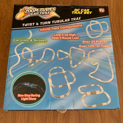 LOT 28 B: 3 NIP Zoom Tubes Car Trax RC Car Trax Set