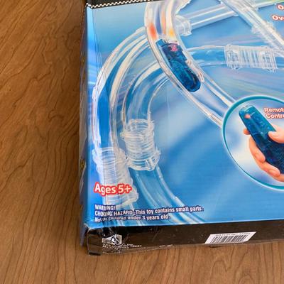 LOT 28 B: 3 NIP Zoom Tubes Car Trax RC Car Trax Set