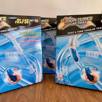LOT 28 B: 3 NIP Zoom Tubes Car Trax RC Car Trax Set