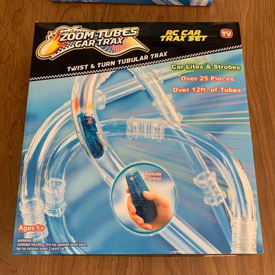 LOT 28 B: 3 NIP Zoom Tubes Car Trax RC Car Trax Set