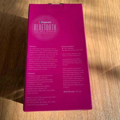 LOT 33 A: NIP Polaroid Bluetooth Portable Speaker & Mainstays Speaker Light w/ Cord