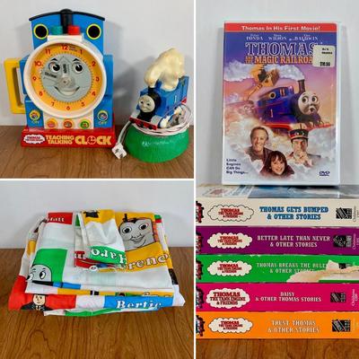 LOT 40 A: Thomas The Tank Engine Collection; Teaching Talking Clock, Happiness Express Portable Lamp, VHS's, DVD, Curtains, Flat...