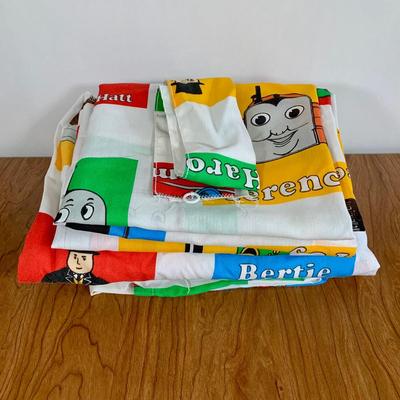 LOT 40 A: Thomas The Tank Engine Collection; Teaching Talking Clock, Happiness Express Portable Lamp, VHS's, DVD, Curtains, Flat...