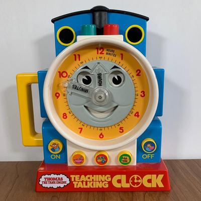 LOT 40 A: Thomas The Tank Engine Collection; Teaching Talking Clock, Happiness Express Portable Lamp, VHS's, DVD, Curtains, Flat...