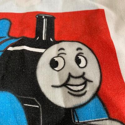 LOT 40 A: Thomas The Tank Engine Collection; Teaching Talking Clock, Happiness Express Portable Lamp, VHS's, DVD, Curtains, Flat...