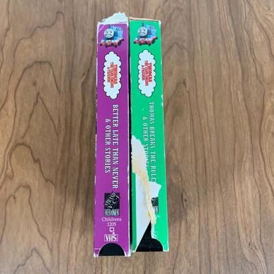 LOT 40 A: Thomas The Tank Engine Collection; Teaching Talking Clock, Happiness Express Portable Lamp, VHS's, DVD, Curtains, Flat...