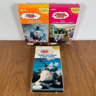 LOT 40 A: Thomas The Tank Engine Collection; Teaching Talking Clock, Happiness Express Portable Lamp, VHS's, DVD, Curtains, Flat...