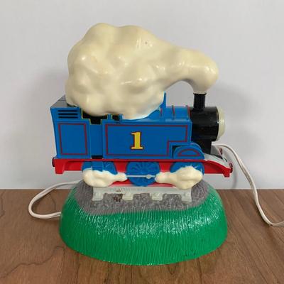 LOT 40 A: Thomas The Tank Engine Collection; Teaching Talking Clock, Happiness Express Portable Lamp, VHS's, DVD, Curtains, Flat...