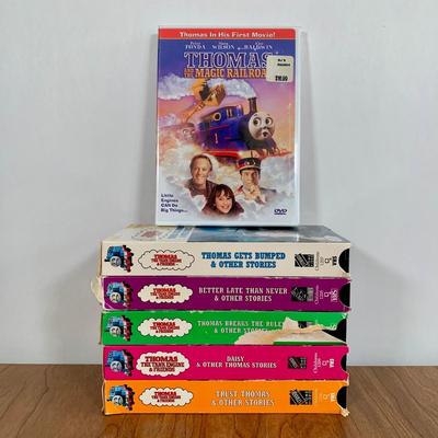 LOT 40 A: Thomas The Tank Engine Collection; Teaching Talking Clock, Happiness Express Portable Lamp, VHS's, DVD, Curtains, Flat...