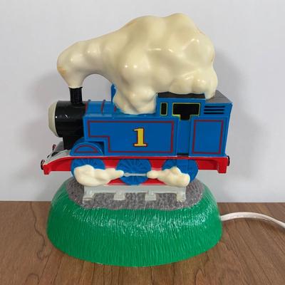 LOT 40 A: Thomas The Tank Engine Collection; Teaching Talking Clock, Happiness Express Portable Lamp, VHS's, DVD, Curtains, Flat...