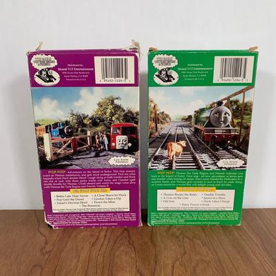 LOT 40 A: Thomas The Tank Engine Collection; Teaching Talking Clock, Happiness Express Portable Lamp, VHS's, DVD, Curtains, Flat...