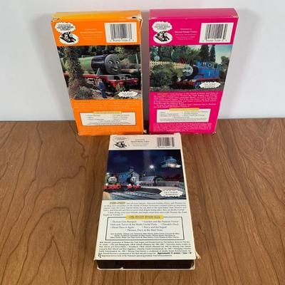 LOT 40 A: Thomas The Tank Engine Collection; Teaching Talking Clock, Happiness Express Portable Lamp, VHS's, DVD, Curtains, Flat...