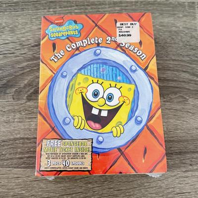 LOT 77B: Spongebob Squarepants Collection: DVDs, VHS Tapes, Zyrofoam NIP, Pencils, 35mm Disposable Camera