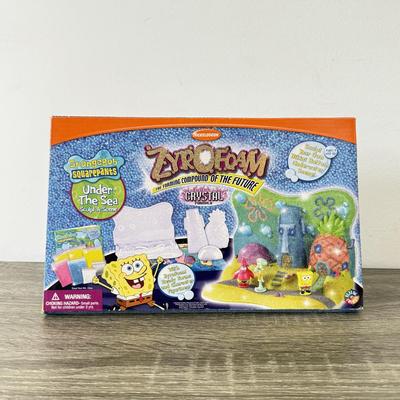 LOT 77B: Spongebob Squarepants Collection: DVDs, VHS Tapes, Zyrofoam NIP, Pencils, 35mm Disposable Camera