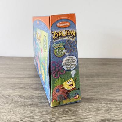 LOT 77B: Spongebob Squarepants Collection: DVDs, VHS Tapes, Zyrofoam NIP, Pencils, 35mm Disposable Camera