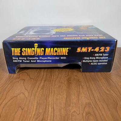 LOT 84 A: NIP The Singing Machine AM/FM Radio With Karaoke Recorder & 2 Teen Hits Cassettes #SMT-423