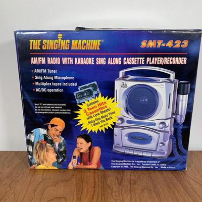 LOT 84 A: NIP The Singing Machine AM/FM Radio With Karaoke Recorder & 2 Teen Hits Cassettes #SMT-423