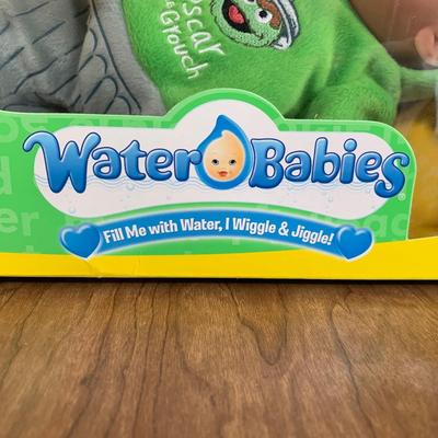 LOT 92 A: 2006 NIP Playmates Water Babies Collection; Sesame Street Oscar The Grouch, Disney Eeyore, & Nickelodeon SpongeBob SquarePants