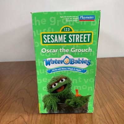 LOT 92 A: 2006 NIP Playmates Water Babies Collection; Sesame Street Oscar The Grouch, Disney Eeyore, & Nickelodeon SpongeBob SquarePants