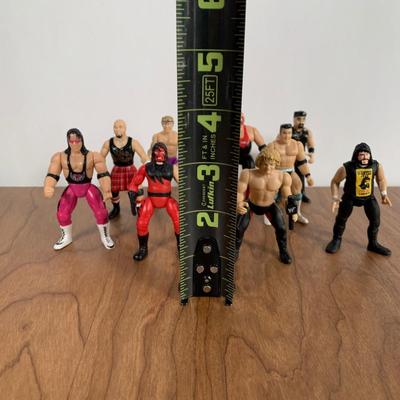 LOT 100 A: 1998 NWO WCW C-Pen, 1999 Collectible Playing Cards, & Miniature Figurines