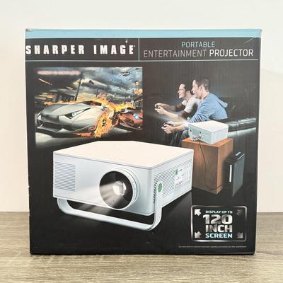 LOT 117L: Sharper Image Portable Entertainment Projector Model 1007589