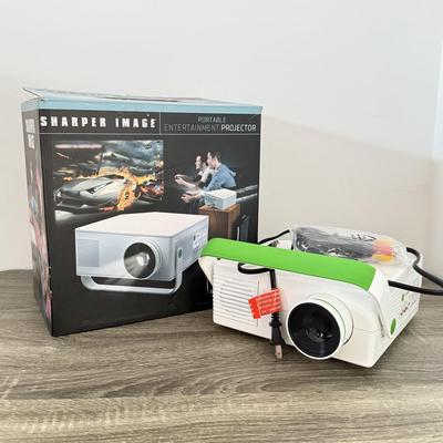 LOT 117L: Sharper Image Portable Entertainment Projector Model 1007589