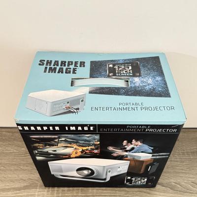 LOT 117L: Sharper Image Portable Entertainment Projector Model 1007589
