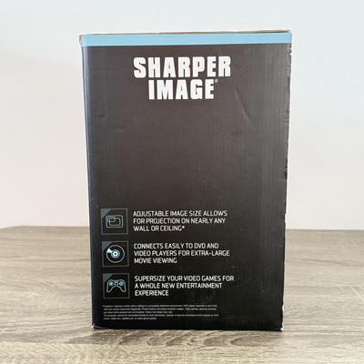 LOT 117L: Sharper Image Portable Entertainment Projector Model 1007589