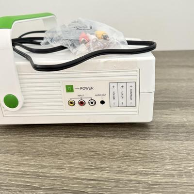 LOT 117L: Sharper Image Portable Entertainment Projector Model 1007589