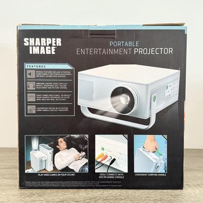 LOT 117L: Sharper Image Portable Entertainment Projector Model 1007589