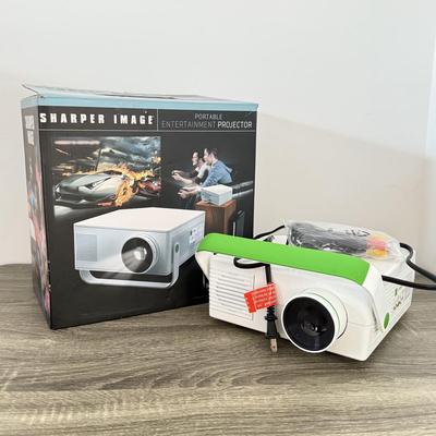 LOT 117L: Sharper Image Portable Entertainment Projector Model 1007589
