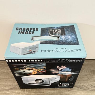 LOT 117L: Sharper Image Portable Entertainment Projector Model 1007589