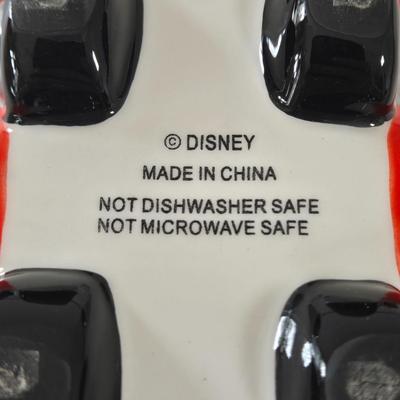 LOT 124B: Mickey Mouse Head Shaped Cutting Board, Metal Trivet, Bowls with Mickey's Feet, Minnie Mouse Cup and Saucer, and Minnie...