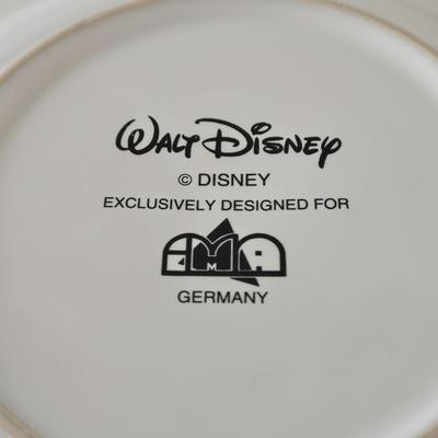 LOT 124B: Mickey Mouse Head Shaped Cutting Board, Metal Trivet, Bowls with Mickey's Feet, Minnie Mouse Cup and Saucer, and Minnie...