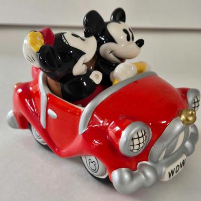 LOT 124B: Mickey Mouse Head Shaped Cutting Board, Metal Trivet, Bowls with Mickey's Feet, Minnie Mouse Cup and Saucer, and Minnie...