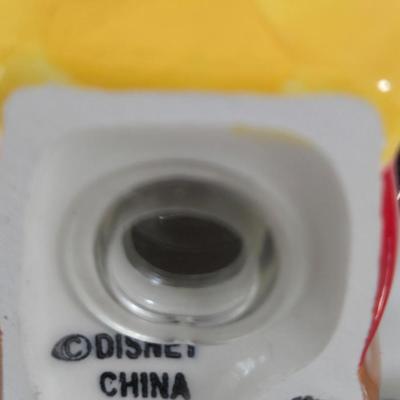 LOT 124B: Mickey Mouse Head Shaped Cutting Board, Metal Trivet, Bowls with Mickey's Feet, Minnie Mouse Cup and Saucer, and Minnie...