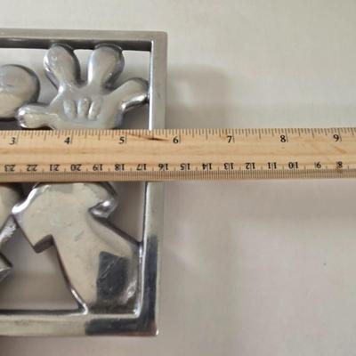LOT 124B: Mickey Mouse Head Shaped Cutting Board, Metal Trivet, Bowls with Mickey's Feet, Minnie Mouse Cup and Saucer, and Minnie...
